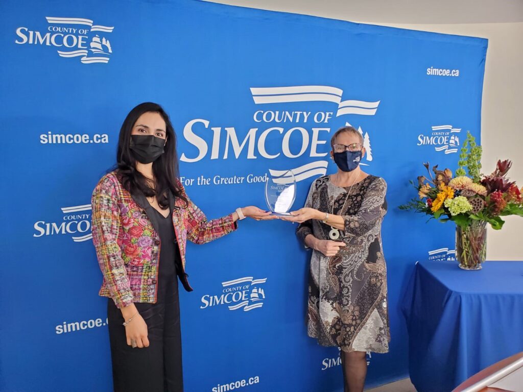 Cecilia Receiving Award from County of Simcoe's Representative
